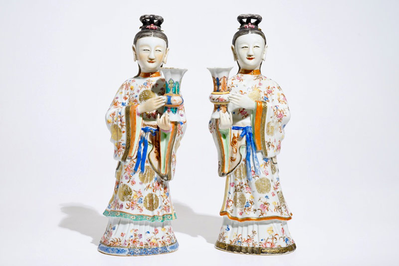 Two large Chinese famille rose candle holders modelled as court ladies