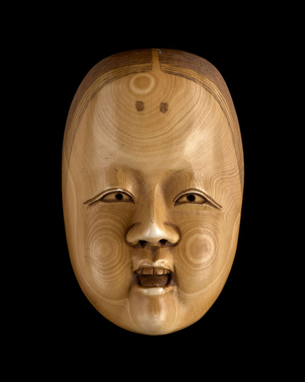 A carved ivory miniature Nô mask