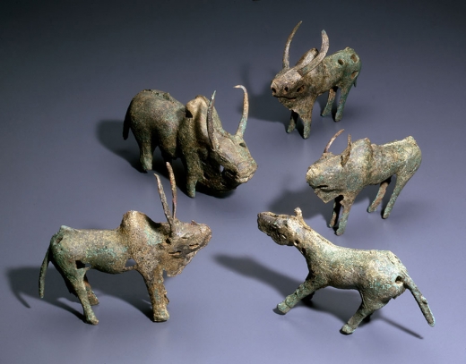 Four Bronze Long-horned Bulls and a Horse