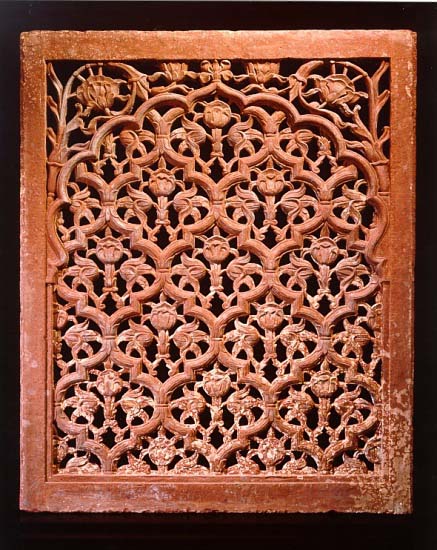 A large sandstone jali screen