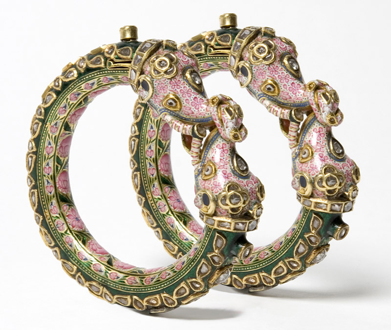 A pair of gold rigid bangles (kada) inset with rose-cut diamonds
