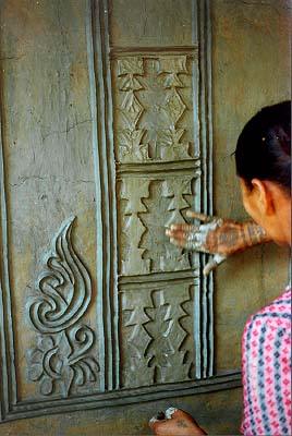 The walls are repainted annually, but the bas relief lasts years