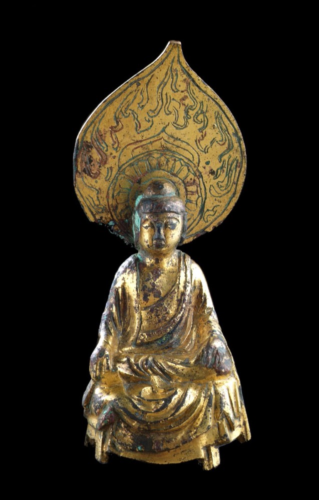 A small votive figure of Buddha