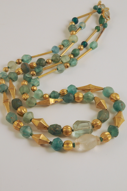 Gold elements and glass beads necklaces