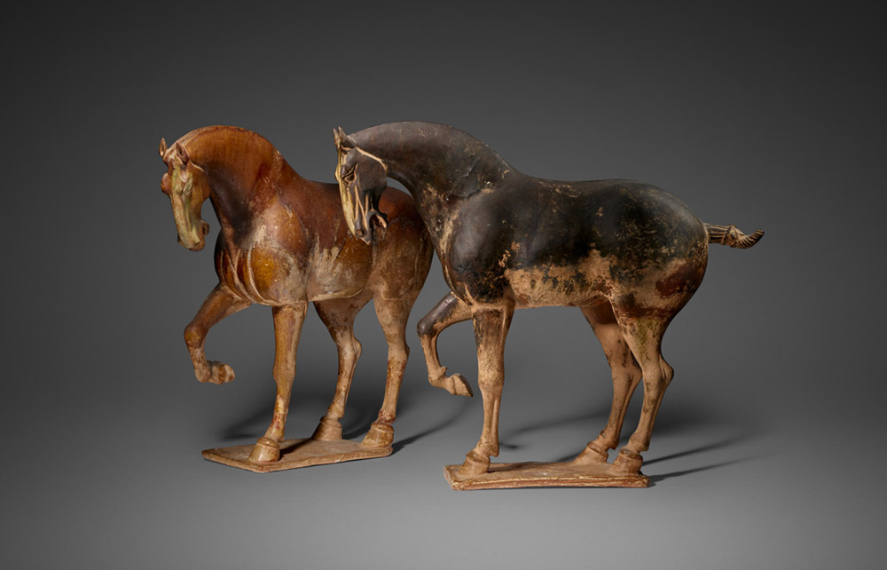 TWO MAGNIFICENT GLAZED POTTERY PRANCING HORSES