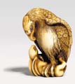 Netsuke of an eagle grasping a hare in its talons