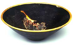 Teabowl with black glaze and leaf pattern